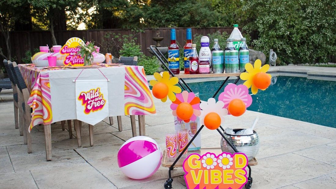 Host a colorful summer party with retro décor, a DIY drink bar, and poolside vibes—perfect for creating a fun, laid-back celebration with friends.