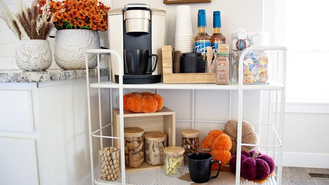 Cozy fall coffee station styled with pumpkins, warm-toned florals, and seasonal toppings—perfect for serving lattes, cider, and festive drinks at autumn gatherings.