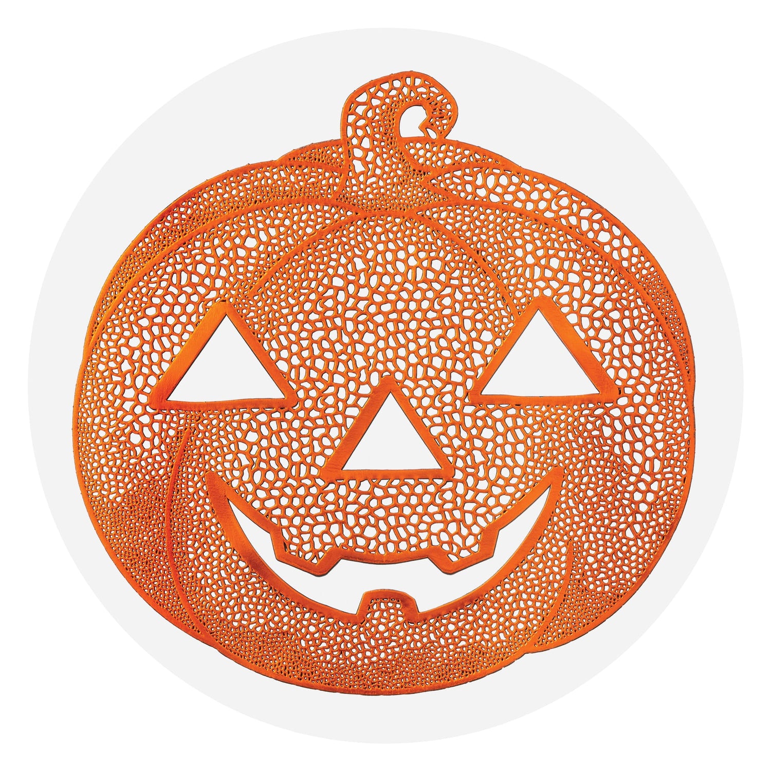  Gemini said An orange, laser-cut silicone placemat in the shape of a smiling jack-o'-lantern with a web-like pattern.