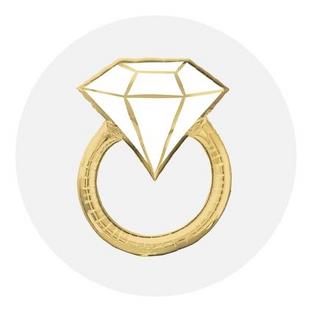 A gold foil balloon shaped like a diamond engagement ring.