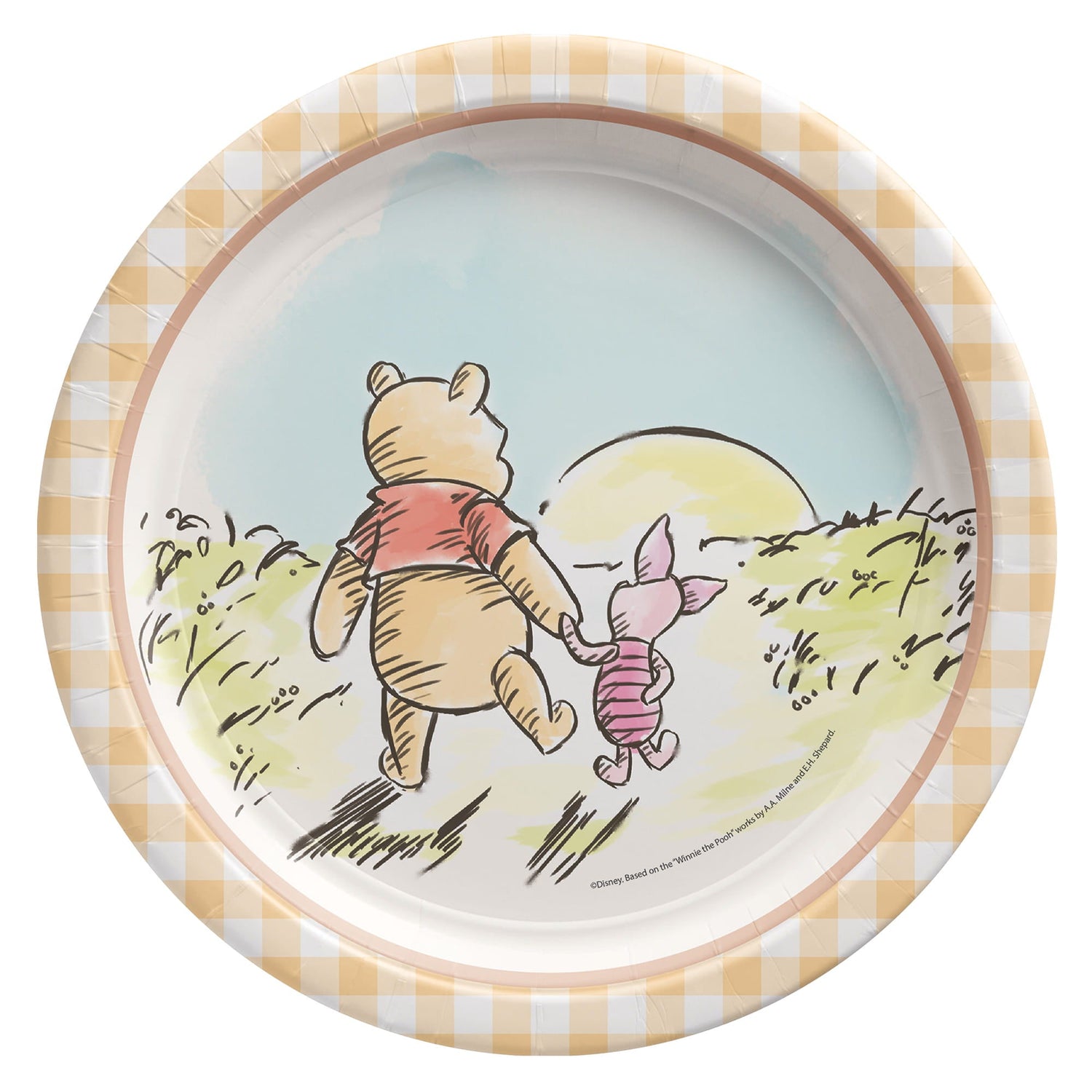 A round paper plate featuring a classic watercolor-style illustration of Winnie the Pooh and Piglet walking hand-in-hand toward a rising sun. The plate has a light orange and white checkered (gingham) border.