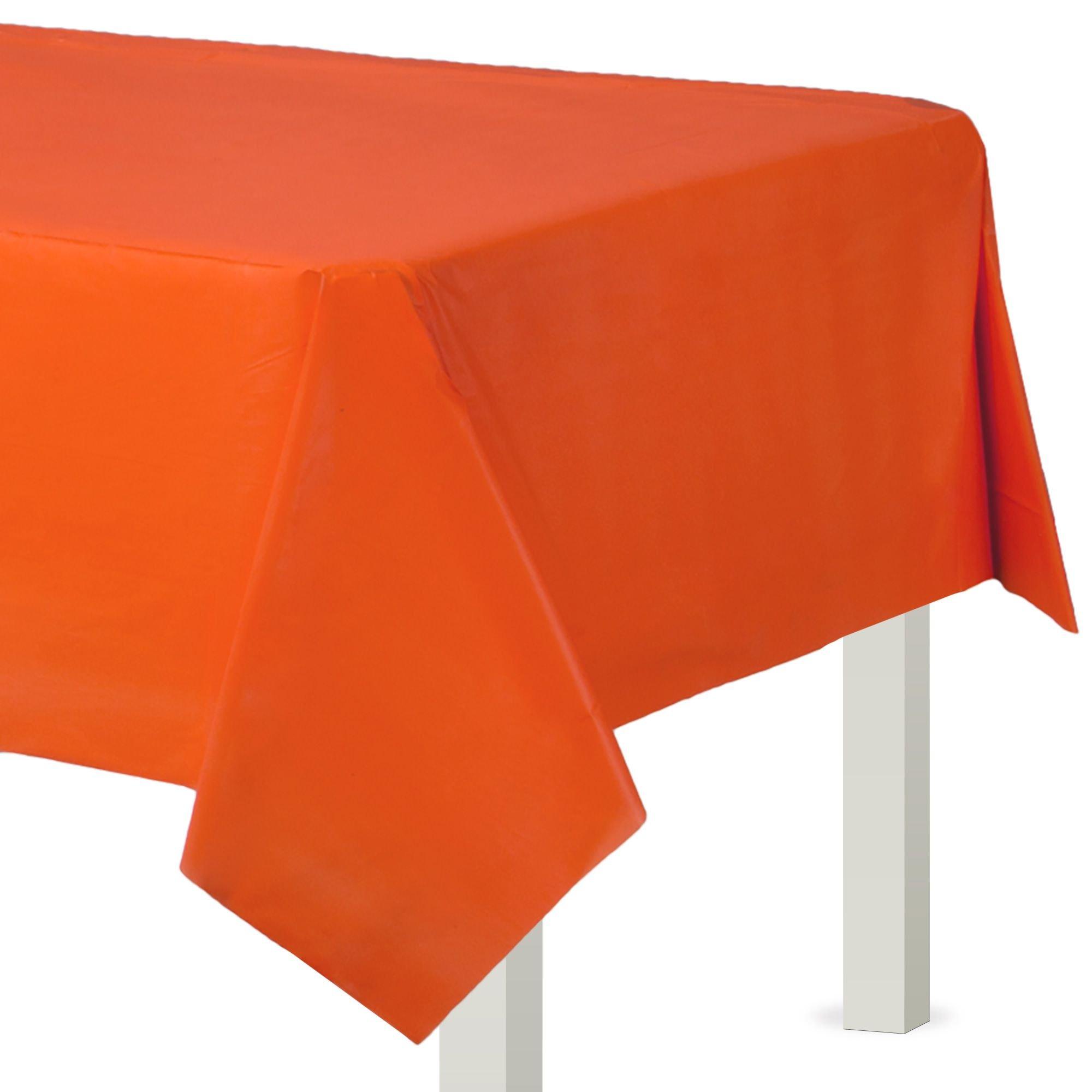 Orange tablecloth on a white table with a white background